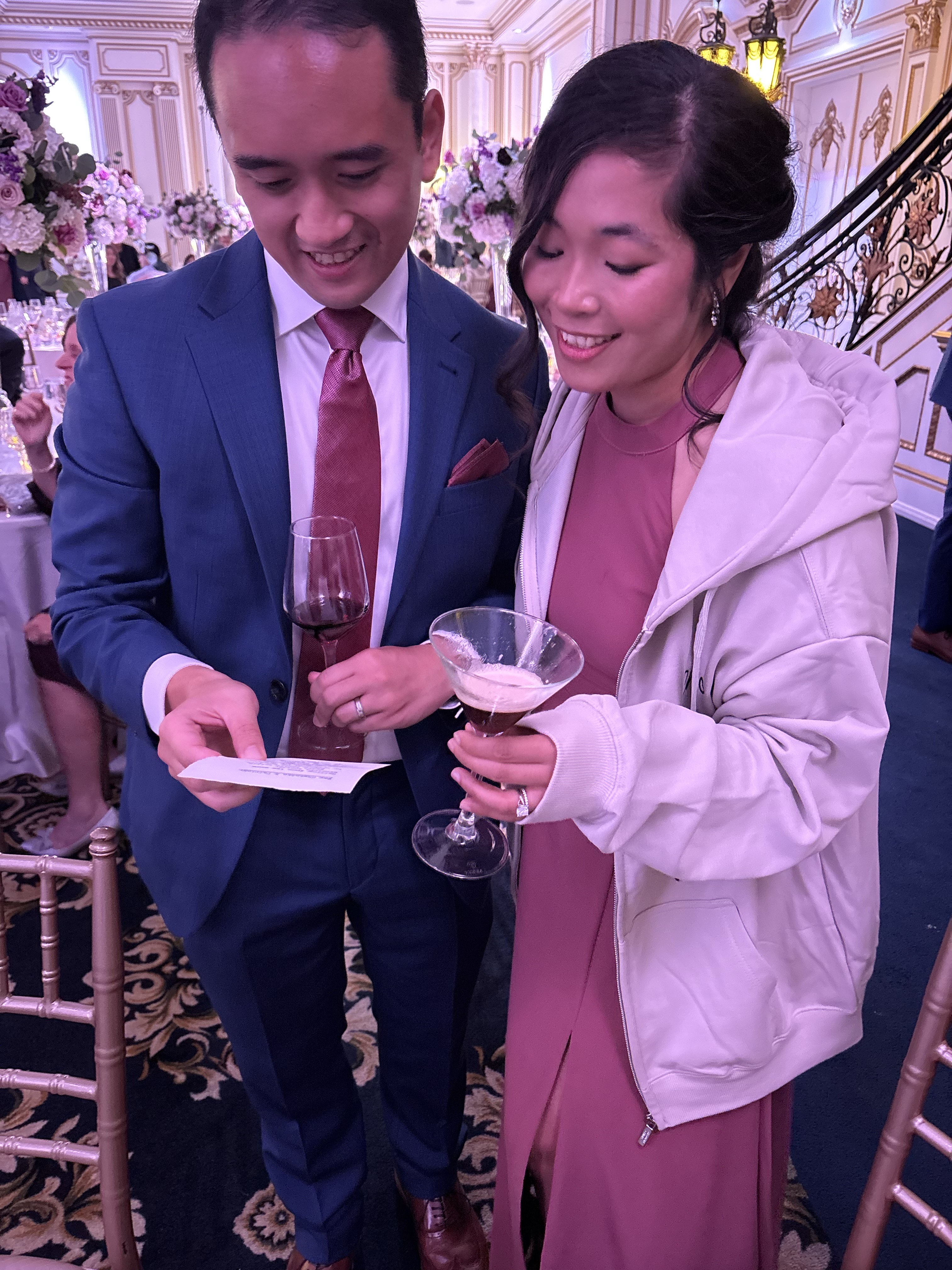 Wedding guests reading custom poetry